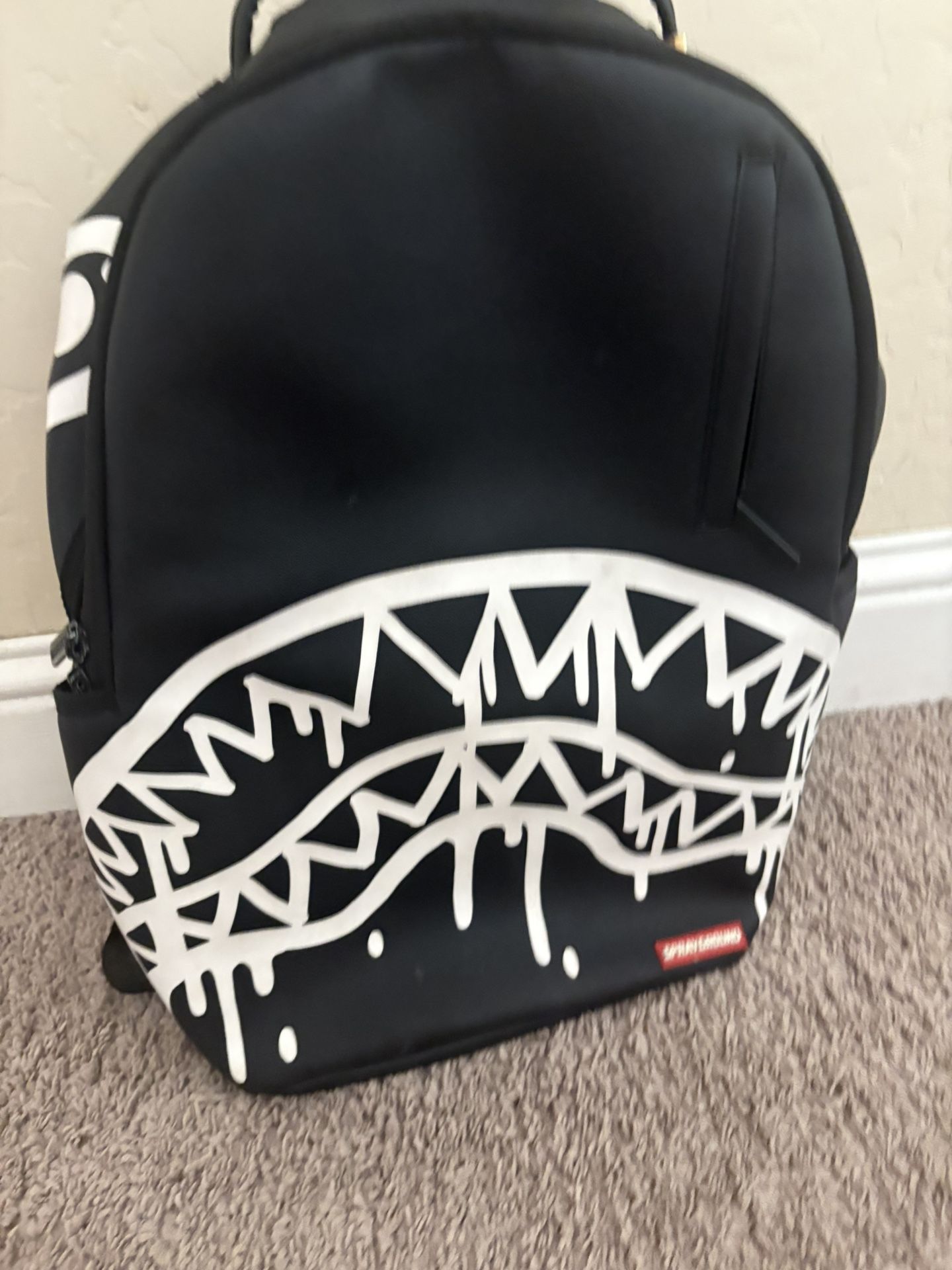 Black white and red sprayground backpack