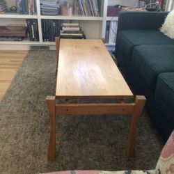 hand made locally coffee table. alder with walnut supporting “floating Top” and curved legs