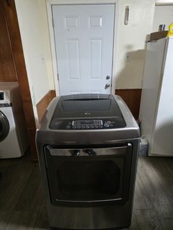 LG STAINLESS STEEL ELECTRIC DRYER EXCELENT CONDITION LARGE CAPACITY HEAVY DUTY DELIVERY AVAILABLE FOR EXTRA FEE WE DO REPAIRS 