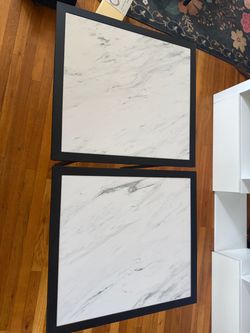 Two end tables and a matching coffee table.