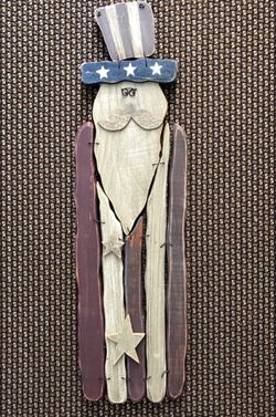 Wood Picket Fence Style Uncle Sam Wall Hanging. 21 inches tall by 6 inches wide.