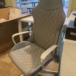 Grey rolling desk chair, perfect condition, barely used, $20