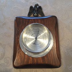 Vintage Springfield brand humidity meter with metal eagle and wood base