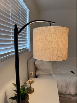 2 black/tan floor lamps