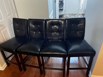 Set of four black barstools