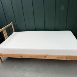 Ikea Twin size wooden bed and Memory Foam mattress both in excellent condition! Free delivery!