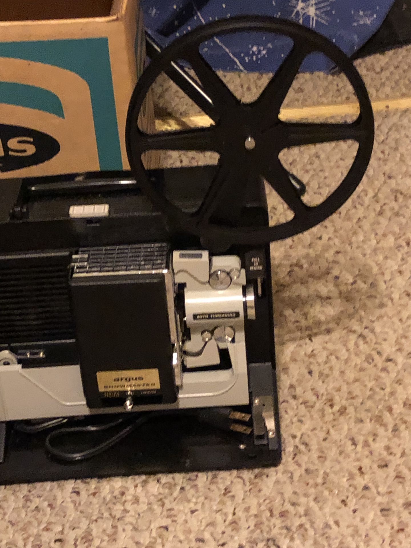 8 mm Argus Showmaster movie projector and screen.