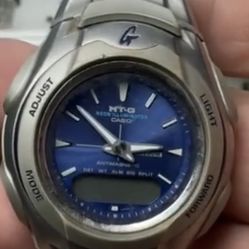 vintage Casio G-Shock MT-G 520 men's watch featuring a blue dial and a stainless steel band