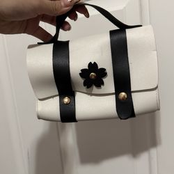 White and black mini handbag with floral detail