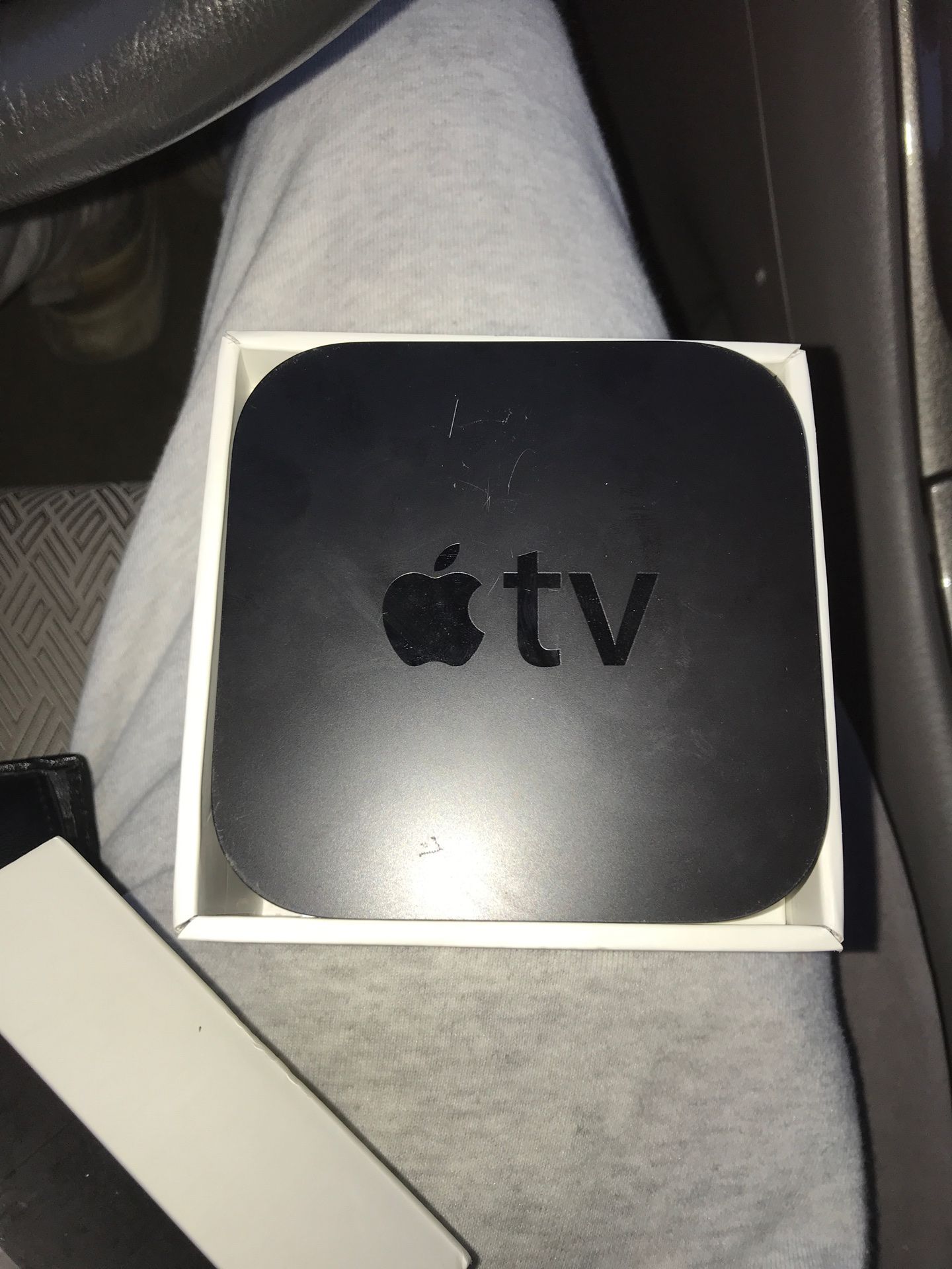 Apple TV with power adapter and remote