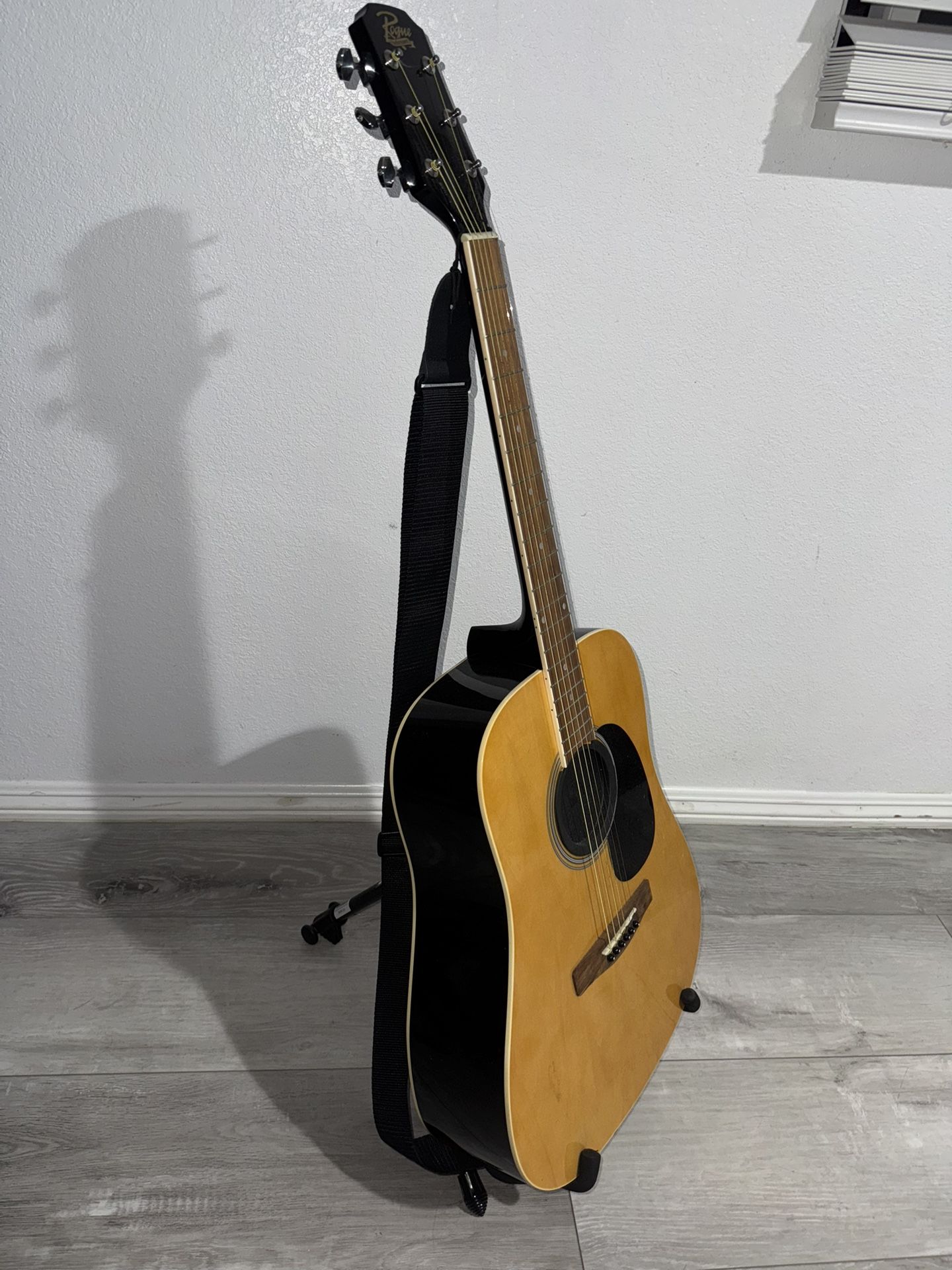 acoustic guitar with stand.