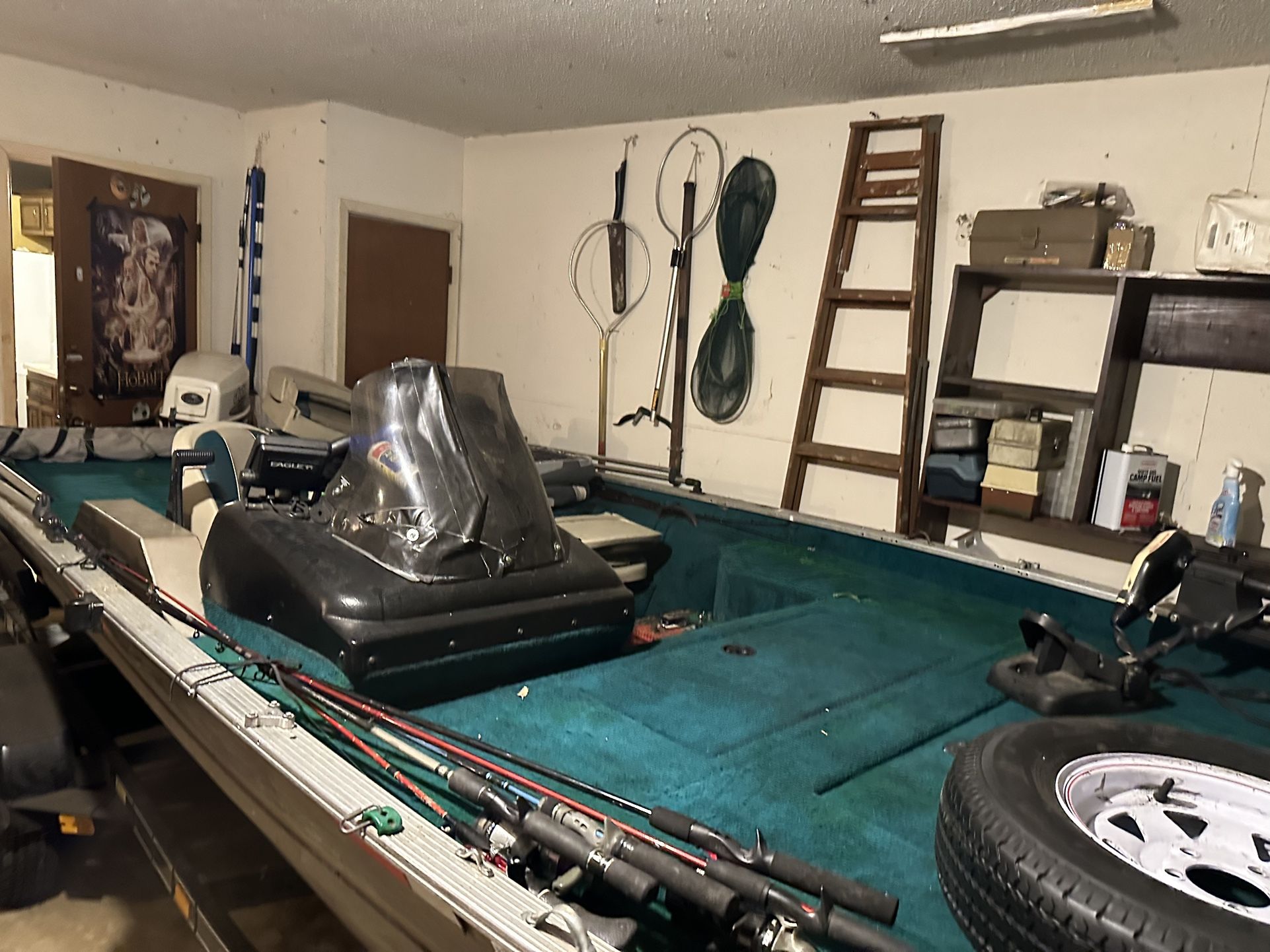 17 Ft. “ Aluminum Boat. The Year Is 2000 That Is Equipped With A Johnson Motor.