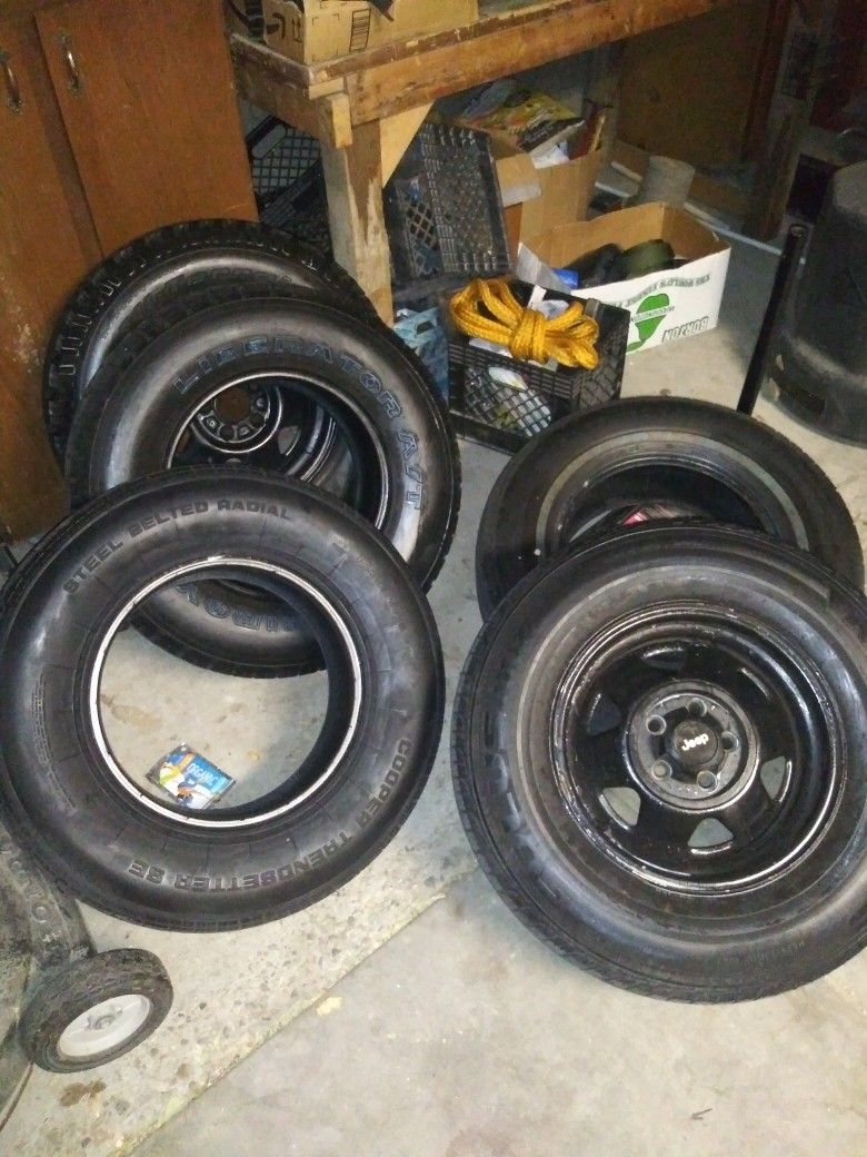 5 Jeep Cherokee Tires ( 235/75/R15) And Two R15 Rims