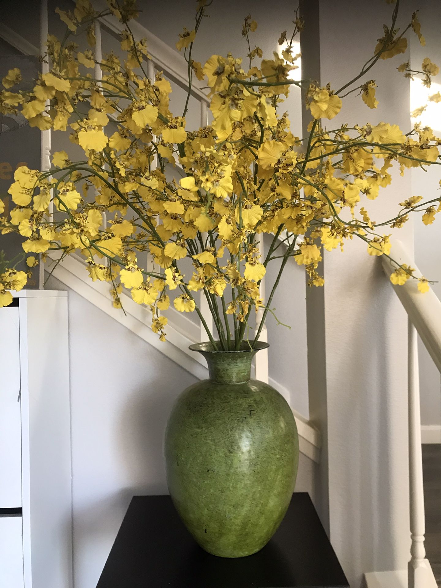 Beautiful metal vase with silk yellow orchid flowers