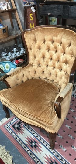 Gorgeous bro at tufted chair