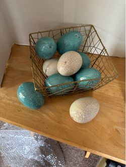 Glass eggs in wire basket