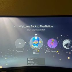 PS5 with monitor and two controllers