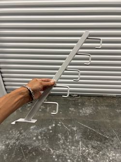 White and black 5 Hook Waterfall for Gridwall is made of square tubing.