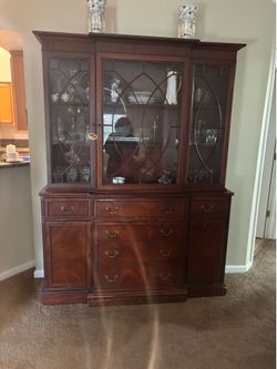China cabinet/buffet. Glass doors on top and drawers on bottom. Beautiful piece.