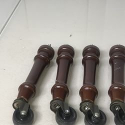 Solid Wood Screw On Ottoman/Chair Legs With Wheels 7 Inch Replacement Rollers. There are a few scratches and scuff marks on a couple but overall in go