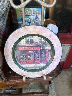 decorative ceramic plate featuring a "Cafe Des Amis" Parisian storefront painting by artist Chiu Tak Hak, produced by Sakura Table