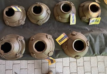 Rustic style cast iron decorative base from The Spring Shop, designed to be placed under flower pots