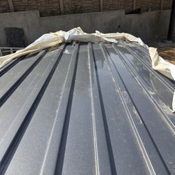 Insulated corrugated metal roofing panels