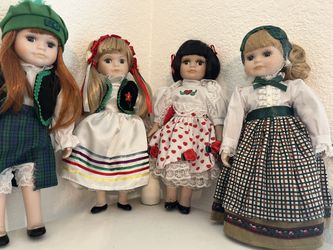 Selling a set of Royalton Collection porcelain dolls, each dressed in beautiful traditional outfits. They’ve been gently displayed and well cared for.