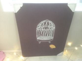 Birdcage with yellow bird