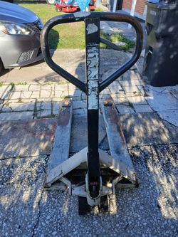 Used Crown Pallet Jack 5000lbs.