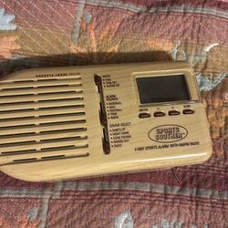 Four-way sports alarm with AM/FM radio Four-way sports alarm with AM FM radio