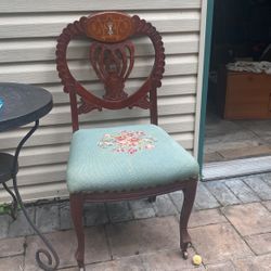 Antique Carved Accent Chair With Wheels