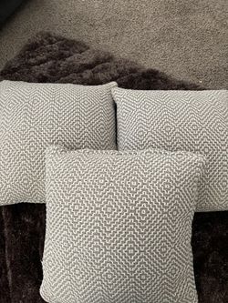Three. Matching pillows.
