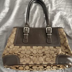 Coach Dark Brown/Beige Signature Canvas and Leather Hampton Tote.