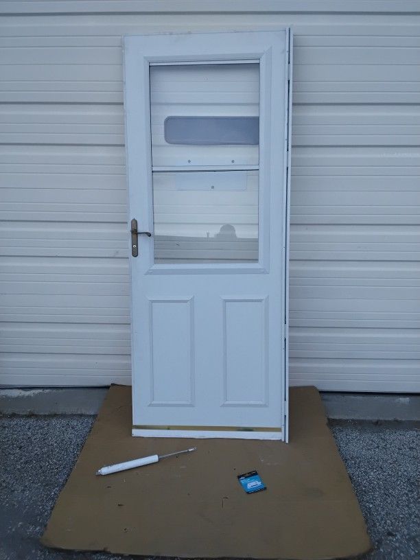 Nice White Storm Door With Built In Screen 32" X 80" Right Hand Swing Very Clean Like New.