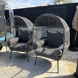 Grey egg chairs with cushions