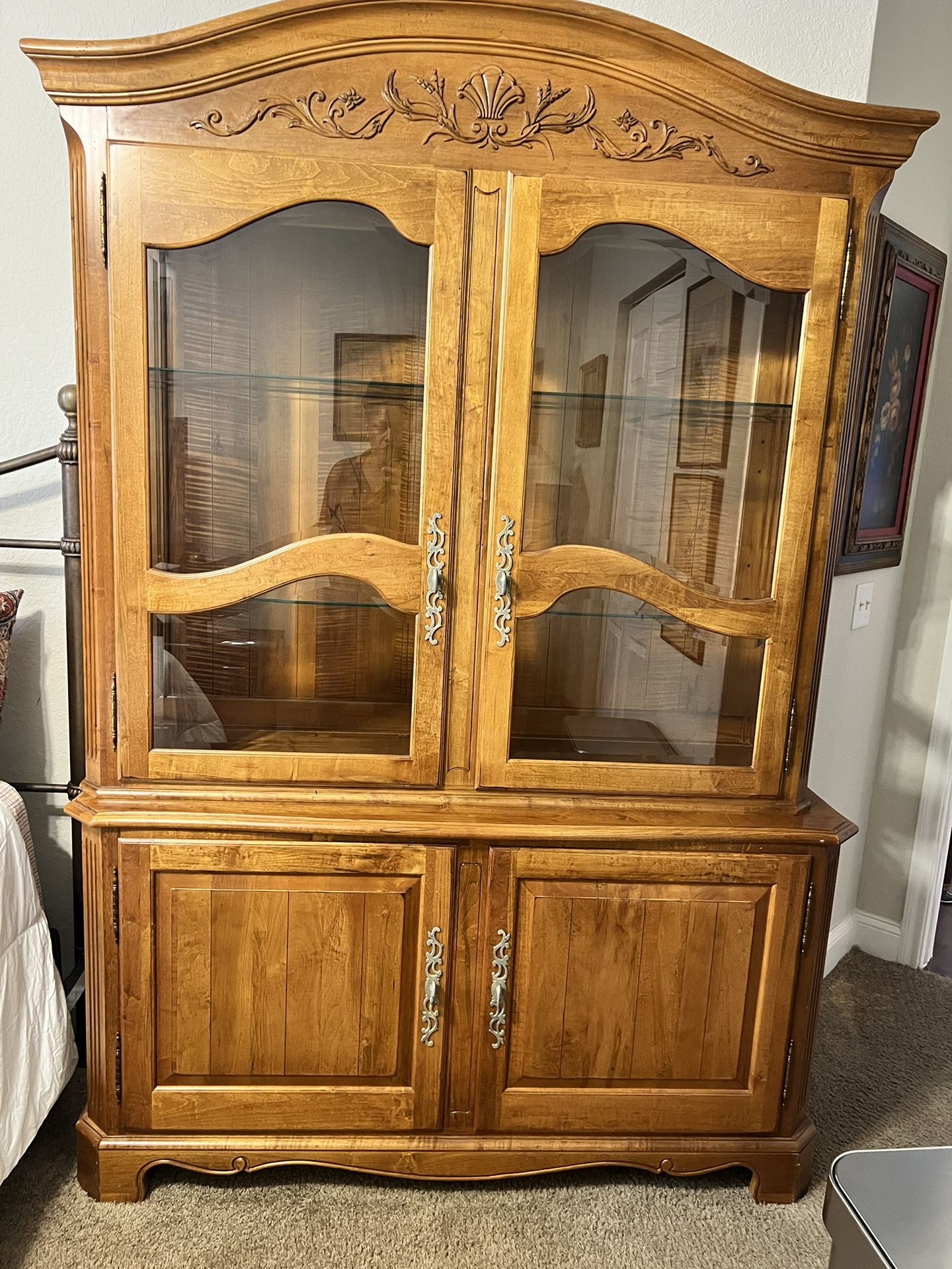 Ethan Allen 2 part china cabinet with beveled glass 