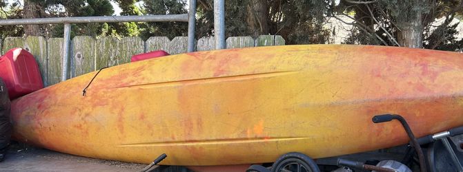 Perception Captiva 16' kayak in a yellow and red color scheme. 