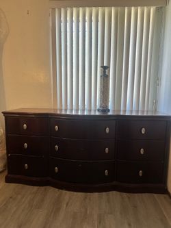 9 drawer dresser dark wood great quality. Deep sturdy drawers