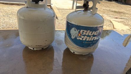 Two empty propane tanks. Two empty propane tanks.