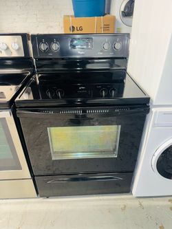 Whirlpool black electric stove—includes a receipt for a 90-day warranty.