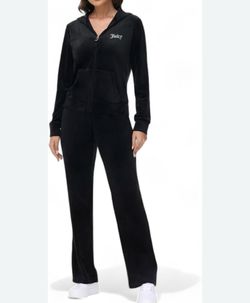 This black Juicy Couture tracksuit features a velour zip-up hoodie with a bedazzled logo and matching flared pants. Size medium used like new