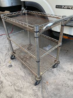 Three-tier metal utility cart with wheels.$35 Located Mount Dora Fla 32757