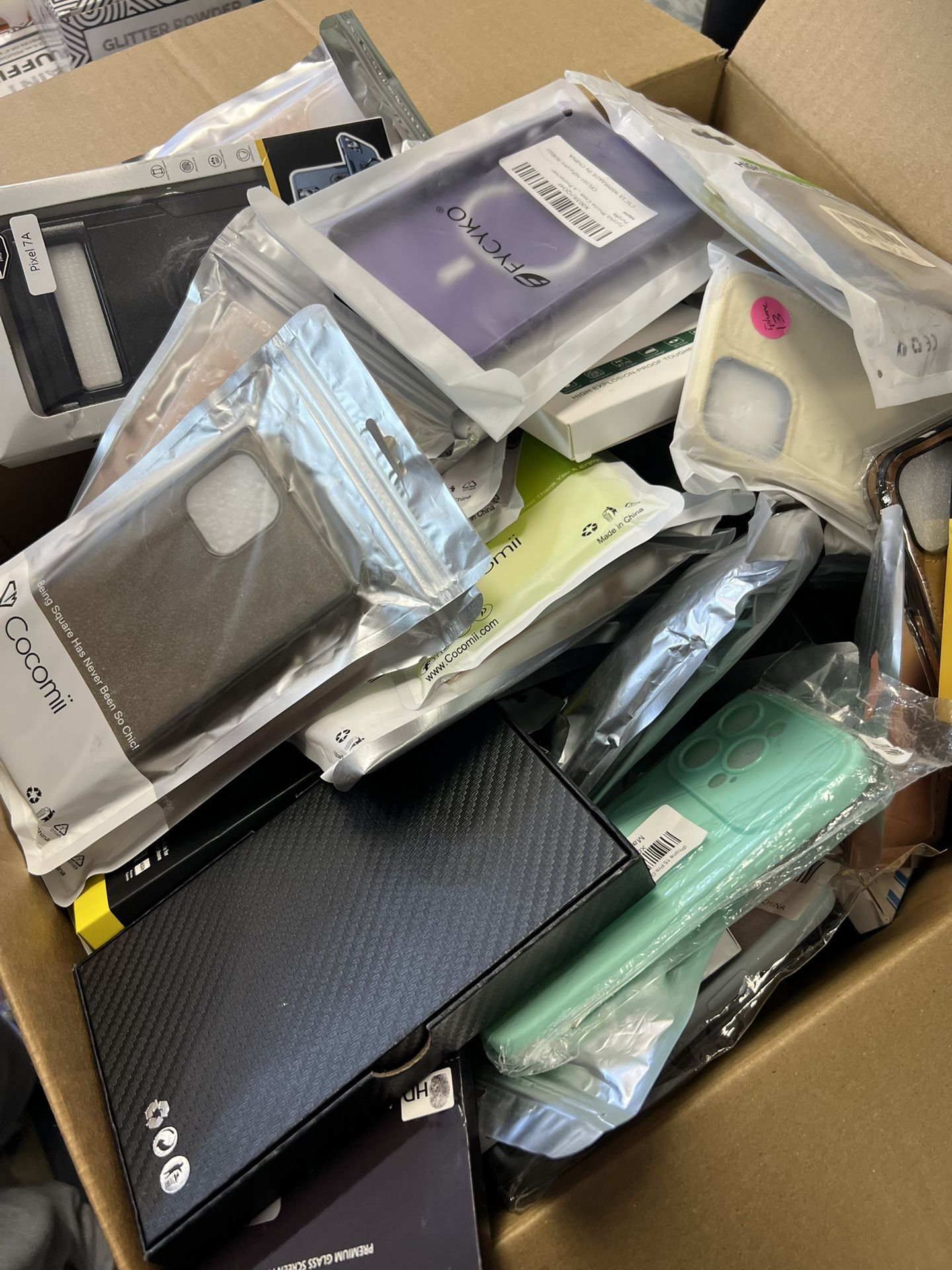 Box full of iphone phone cases