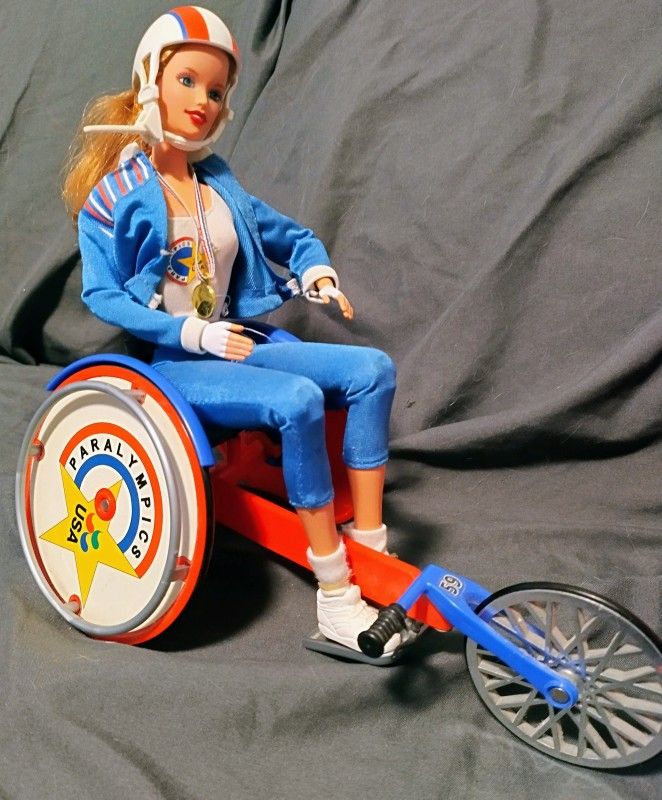 Collectable: 1999 and 2002 Barbie and Becky. 
