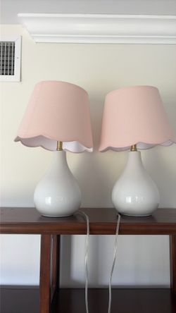 Two matching pink lamps
