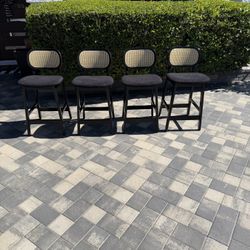 Set of Four Modern Black and Rattan Bar Stools