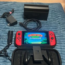 Nintendo switch with docking station, joycon grip case and donkey Kong tropical freeze game 
