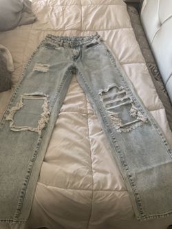 ripped jeans never used