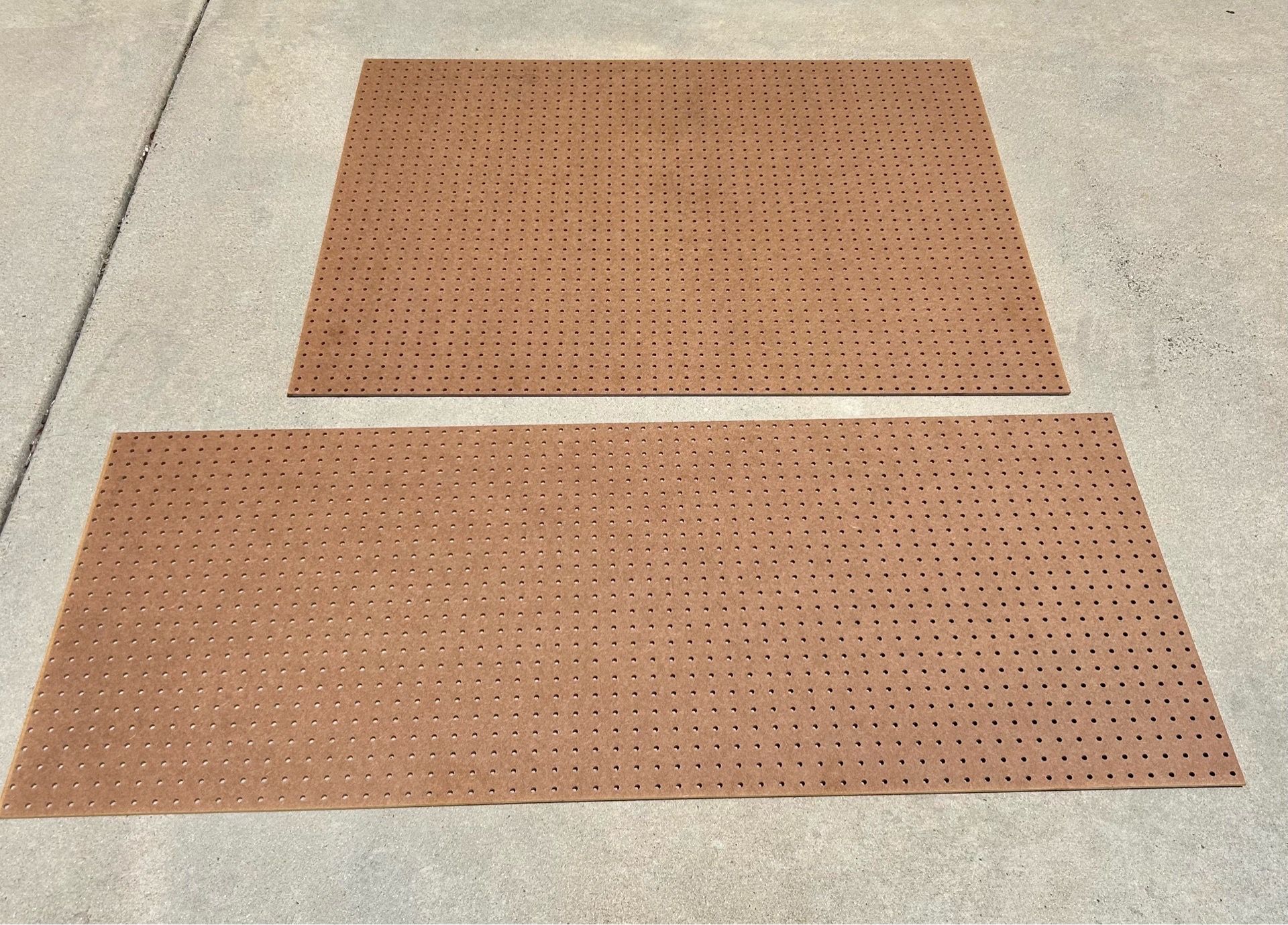 Two brown pegboards